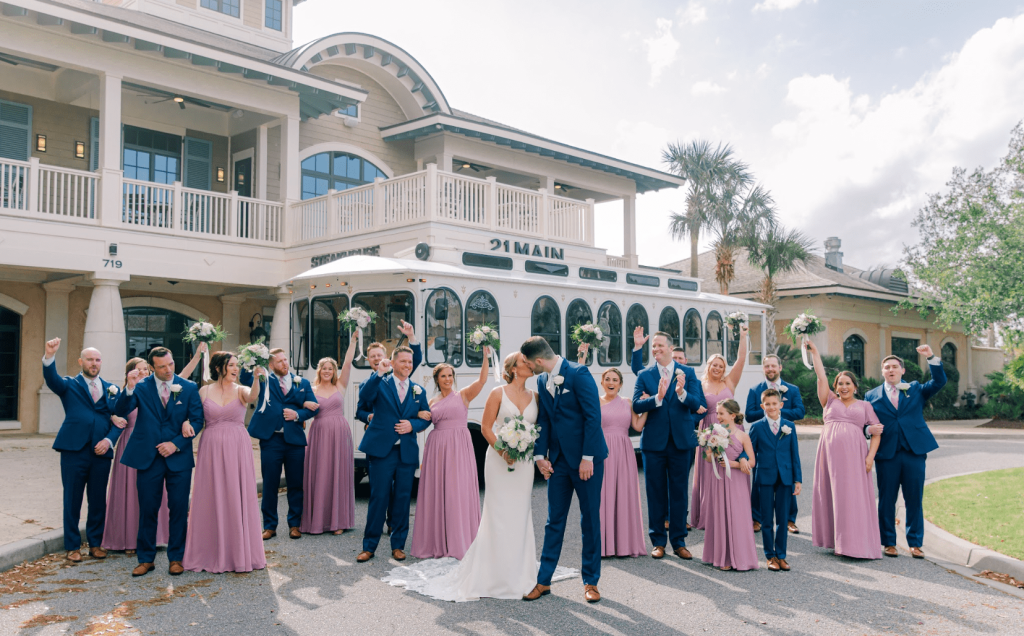 Wedding party celebrates outside 21 Main