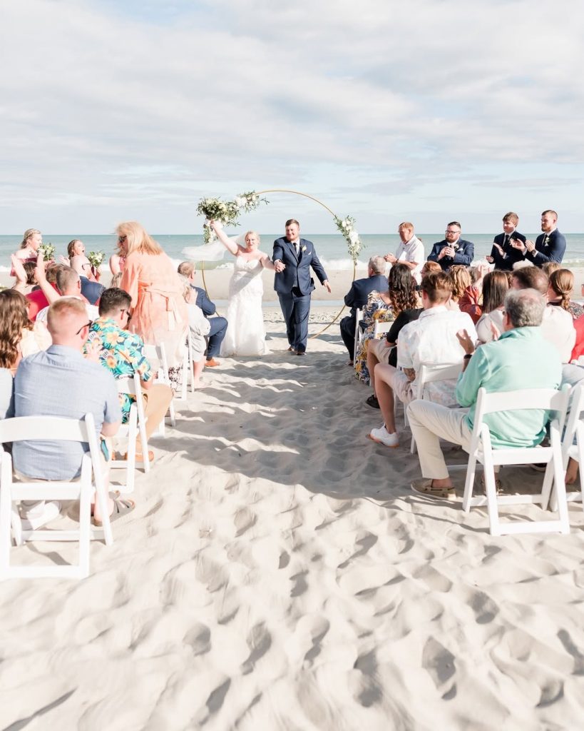 image of couple in ceremony celebrating