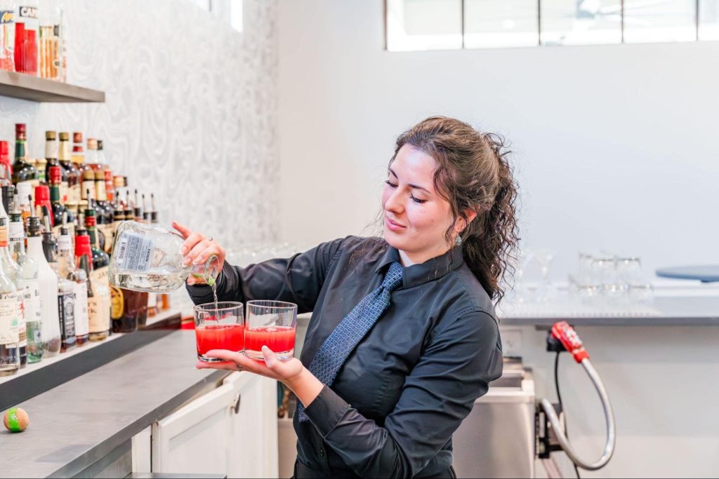 a lady mixing drink
