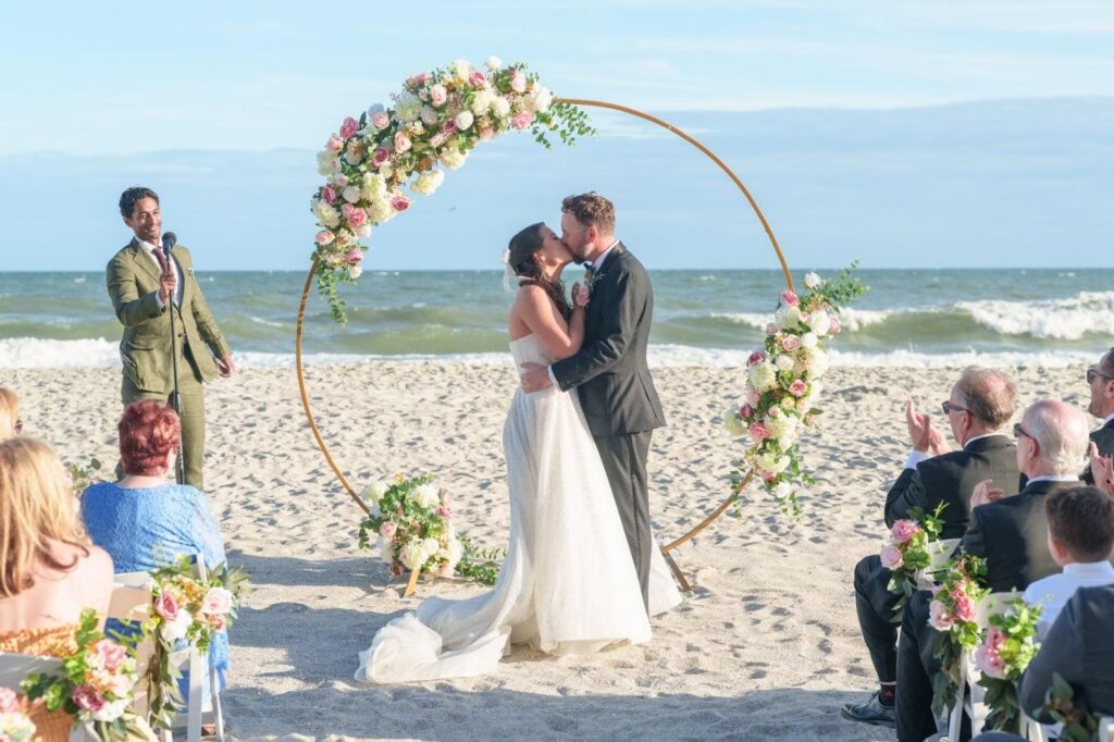 Elegant summer beach wedding ceremony setup at 21 Main Events